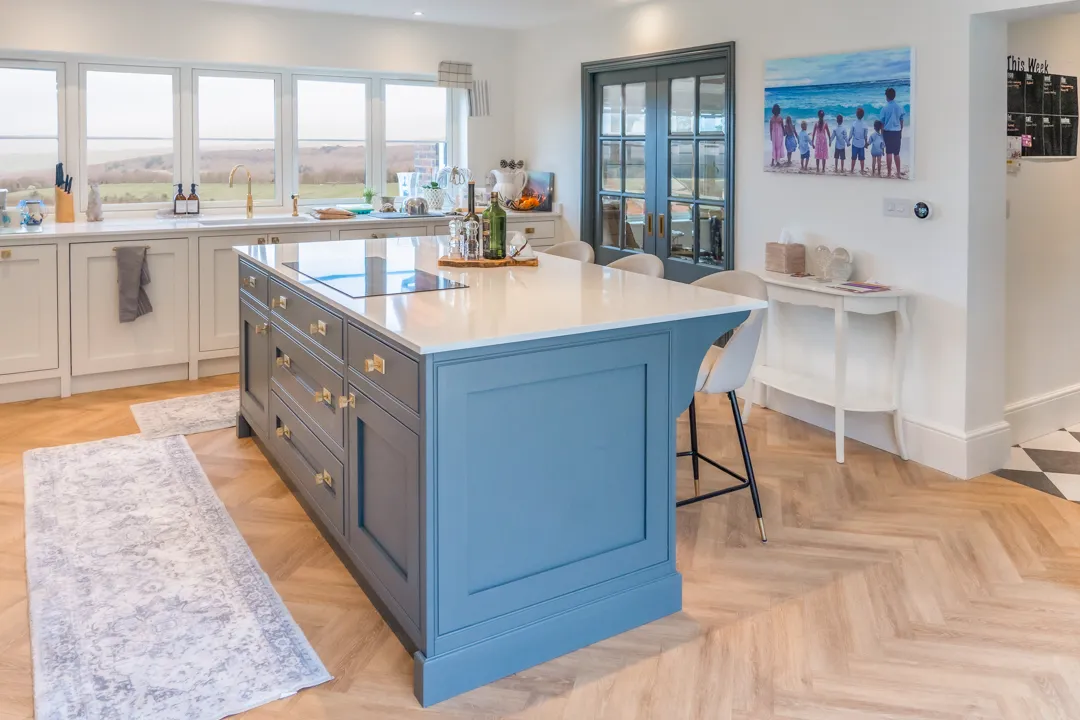 A large kitchen with a center island in the middle of the room.